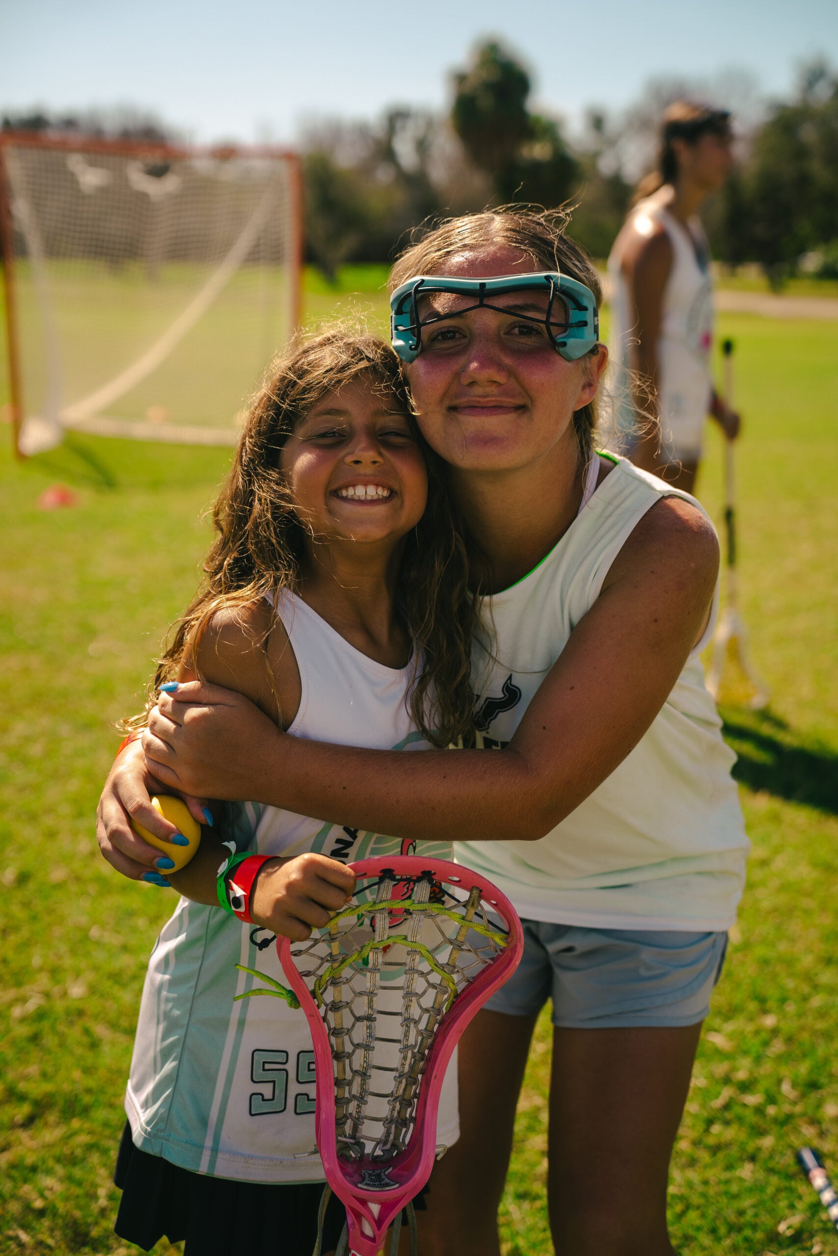 Two young lacrosse players at a Signature Foundation event.